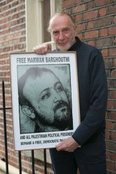 07/05/2014
Artist Jim Fitzpatrick, creator of the iconic image of Che Guevara with a special portrait of husband Marwan Barghouthi which he made during the Irish launch of the International Campaign For The Freedom of Marwan Barghouthi and All Palestinian Political Prisoners in BuswellÕs Hotel, Dublin.
The press conference outlined the history, aims and objectives of the campaign in support of the thousands of Palestinian political prisoners held in Israeli jails which was officially launched on 27 October 2013 from Nelson MandelaÕs cell in the notorious apartheid-era prison on Robben Island.
Photo: Gareth Chaney Collins